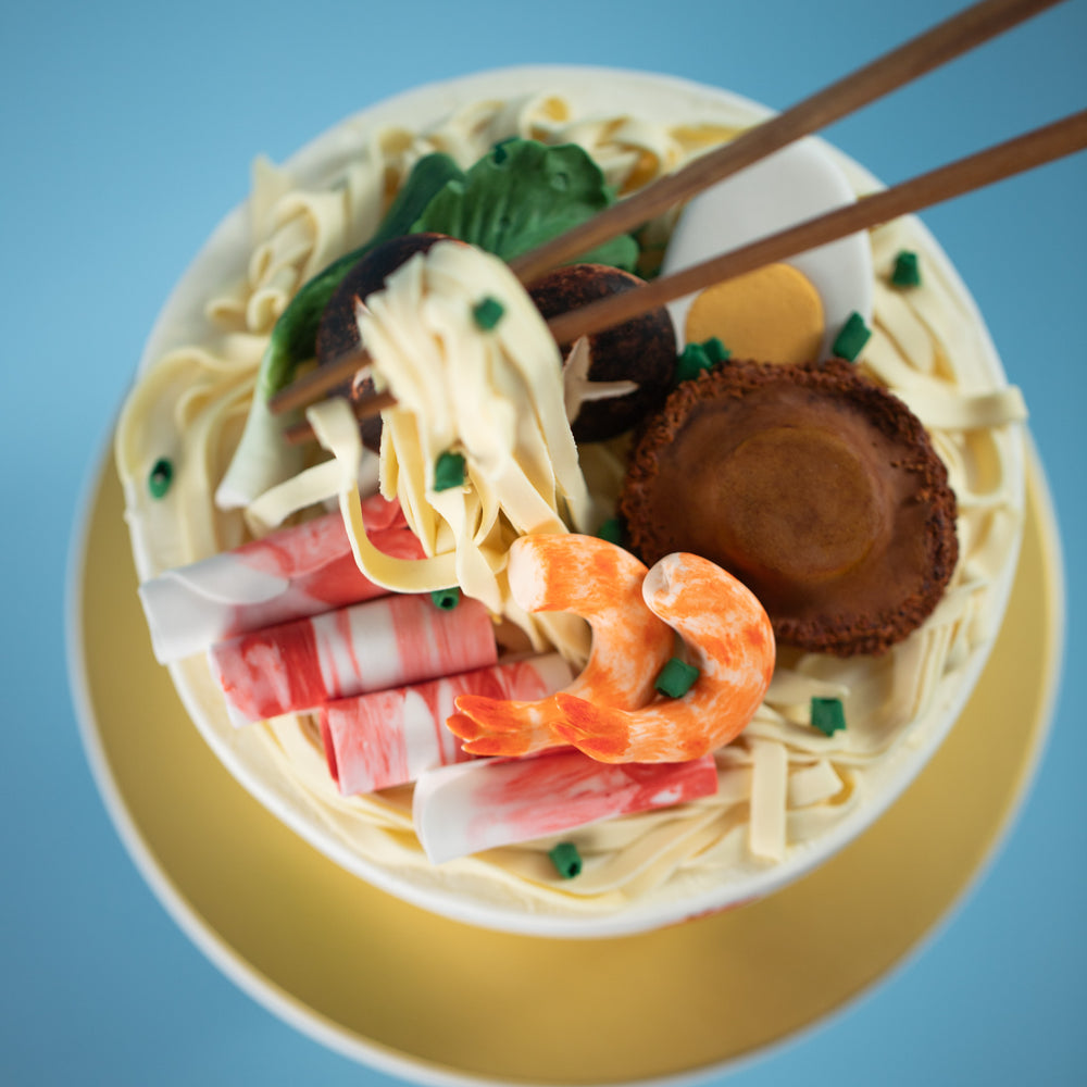 
                  
                    Load image into Gallery viewer, A top view of the noodle cake, where you can clearly see all the &amp;quot;liao&amp;quot; in the noodles. 
                  
                