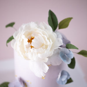 
                  
                    Load image into Gallery viewer, A close up of the white wafer peony. It looks extremely realistic.
                  
                